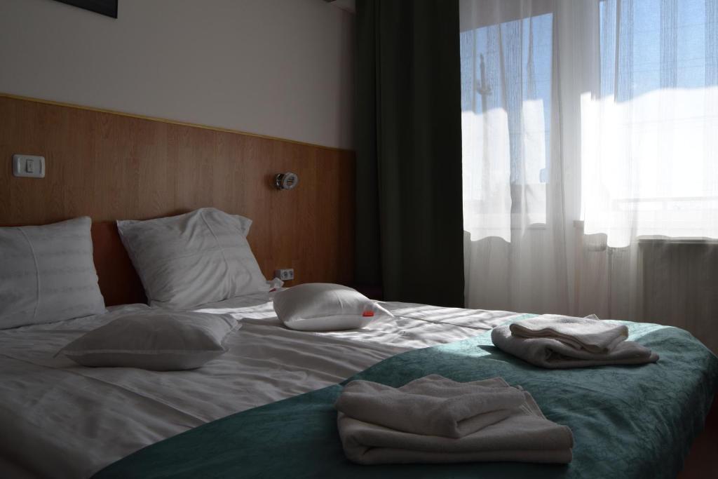 Postel nebo postele na pokoji v ubytování Pension Larisa
