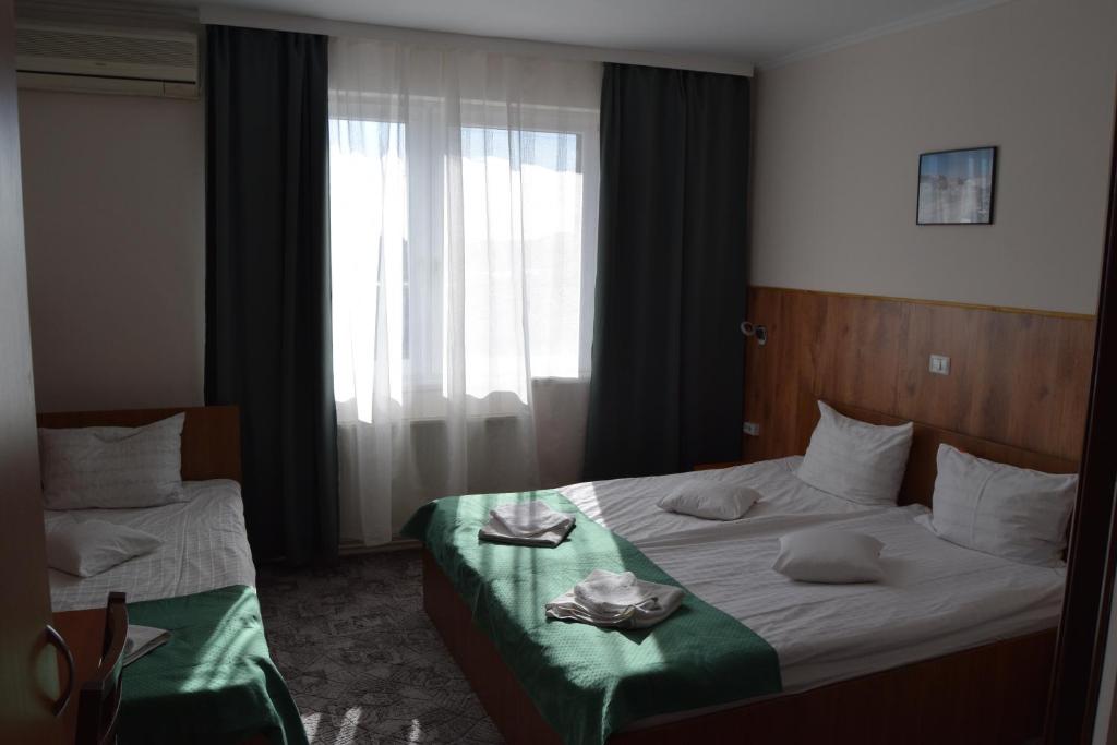 Postel nebo postele na pokoji v ubytování Pension Larisa
