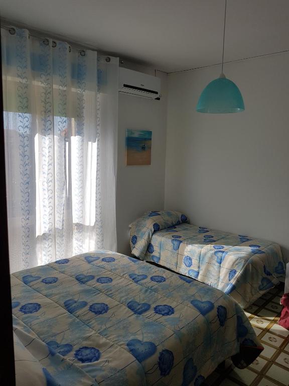 Postel nebo postele na pokoji v ubytování B&B Dolce Casa