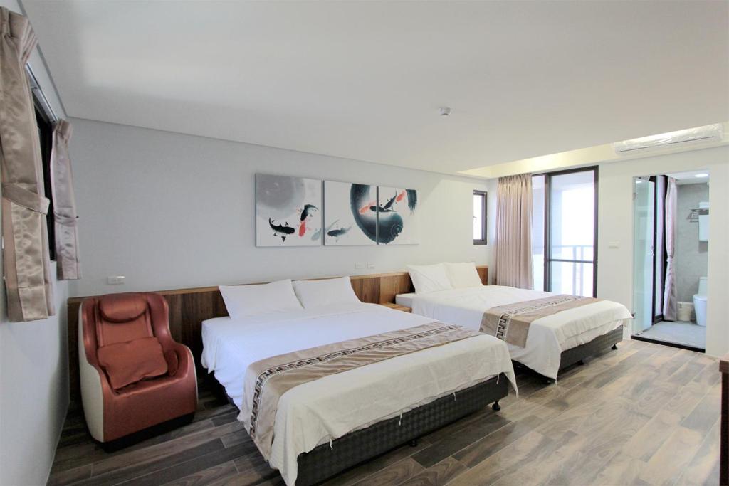 Postel nebo postele na pokoji v ubytování Apause Hotel