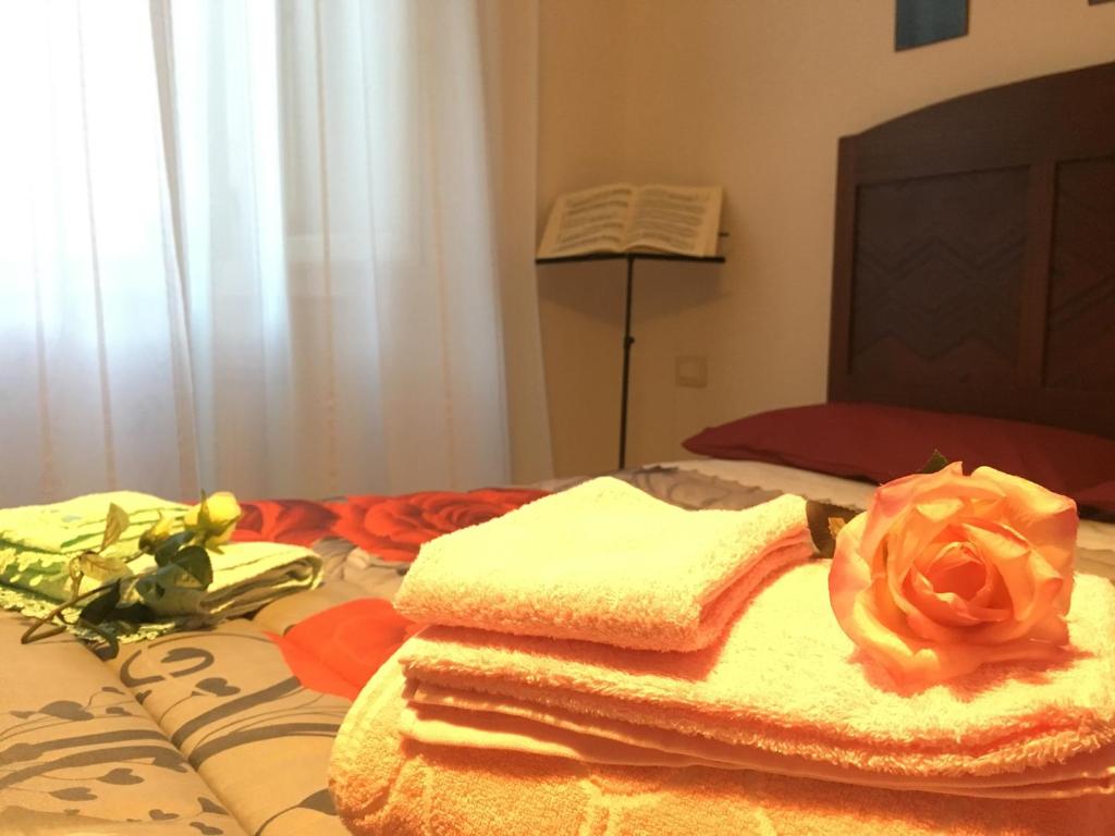 Posteľ alebo postele v izbe v ubytovaní New Alex Home. Al Teatro.