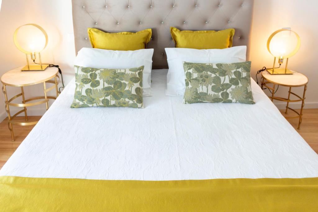 Cama ou camas em um quarto em Graça Apartment