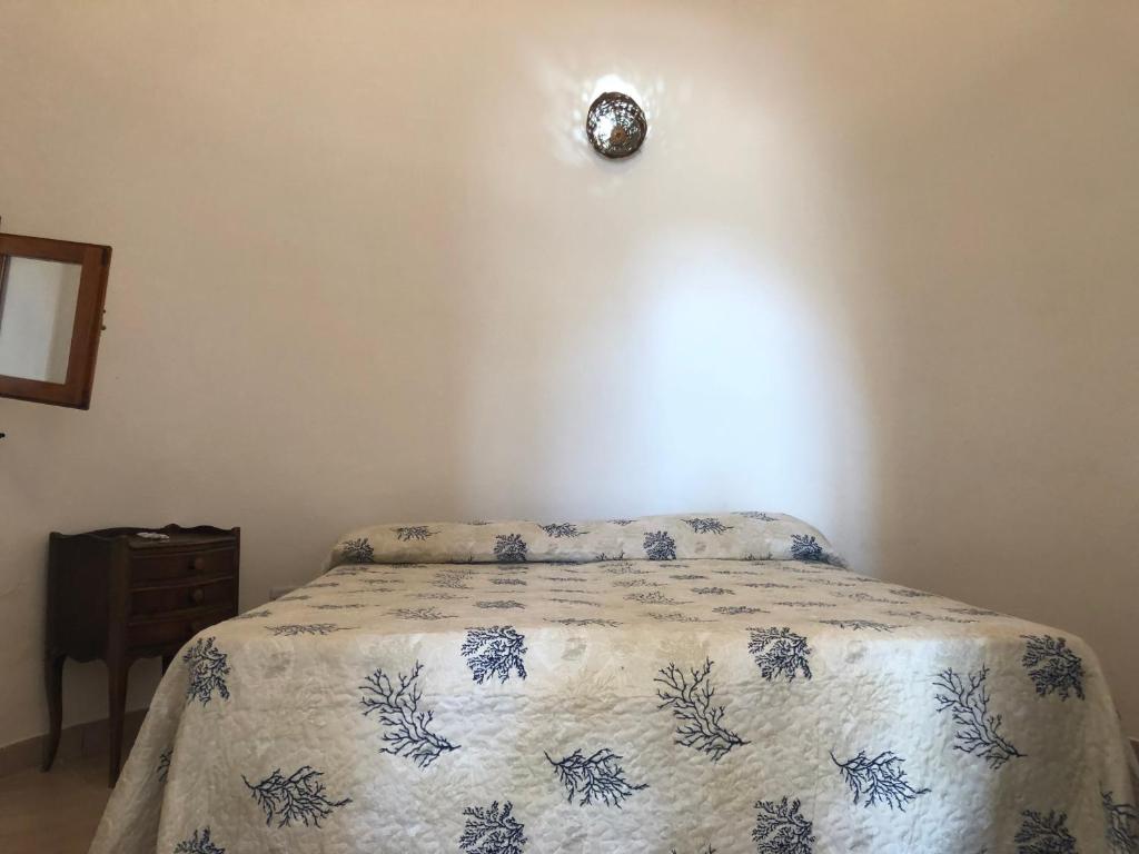 A bed or beds in a room at Villa Trullo di Angela