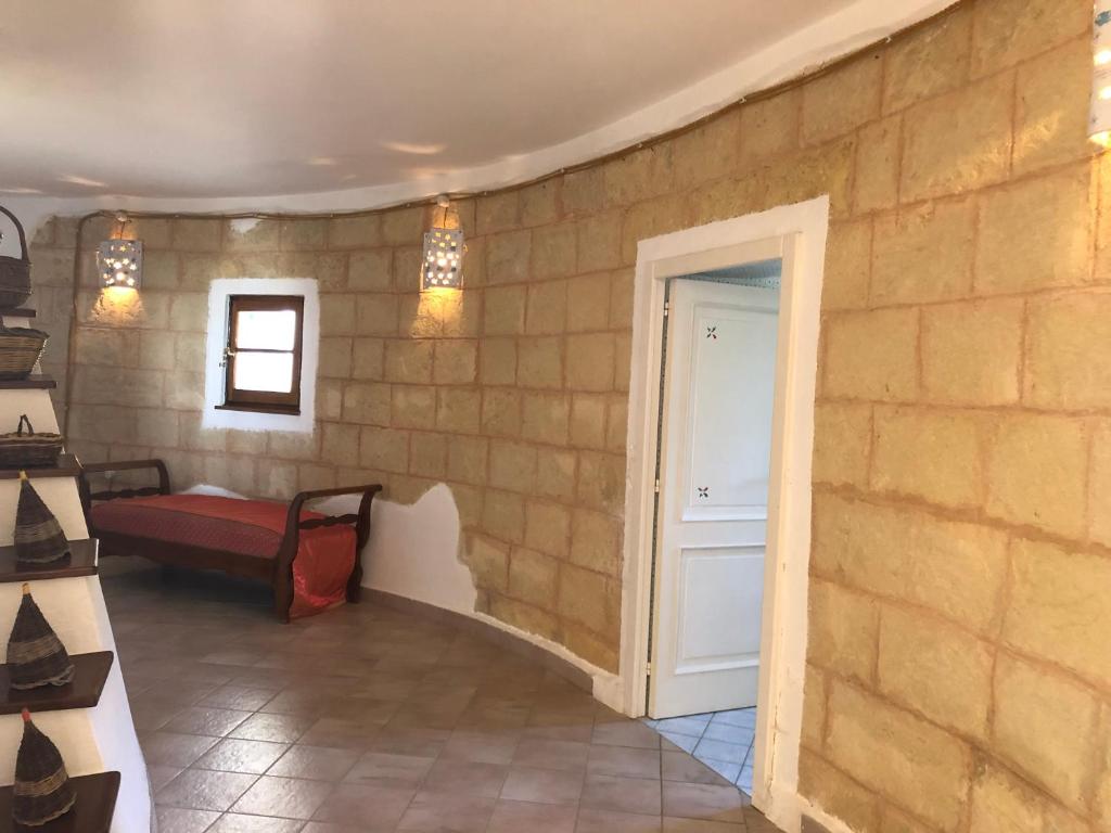 A bed or beds in a room at Villa Trullo di Angela