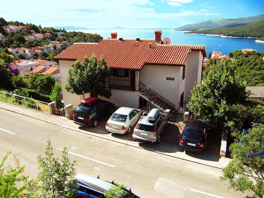 a group of cars parked in front of a house at Apartment Rabac 19 in Rabac