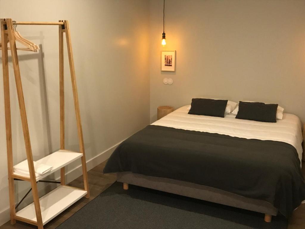 En eller flere senge i et værelse på Welcome inn Viseu