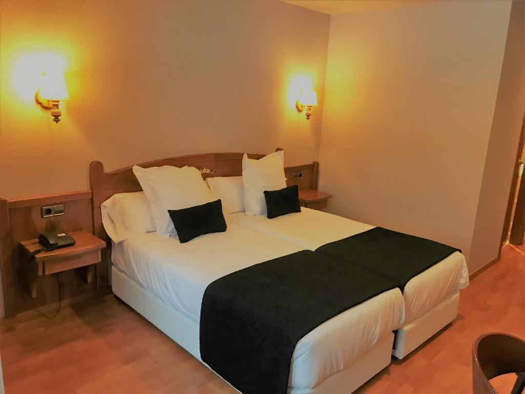 Postel nebo postele na pokoji v ubytování Hotel & SPA Niunit