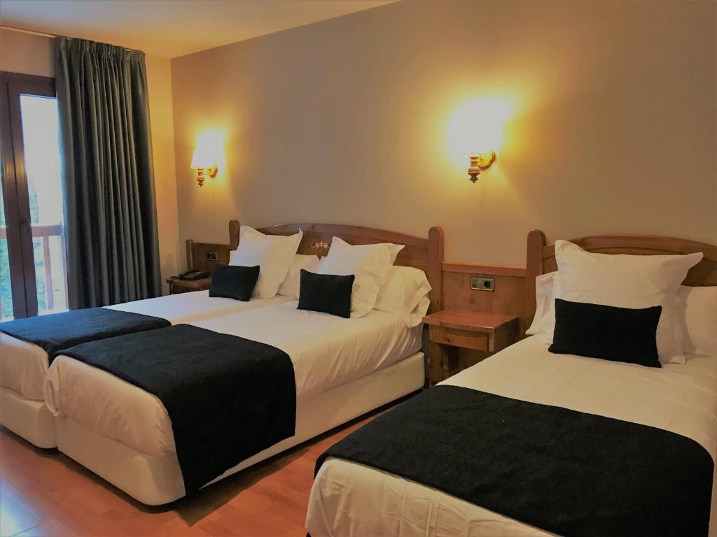 Postel nebo postele na pokoji v ubytování Hotel & SPA Niunit
