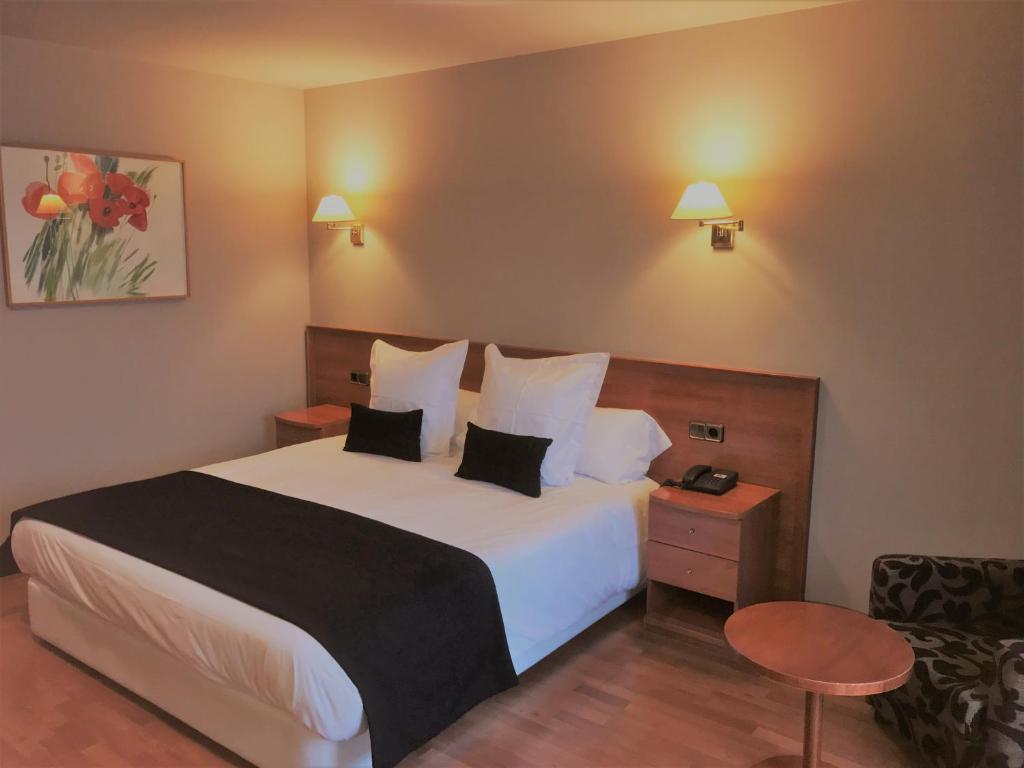 Postel nebo postele na pokoji v ubytování Hotel & SPA Niunit