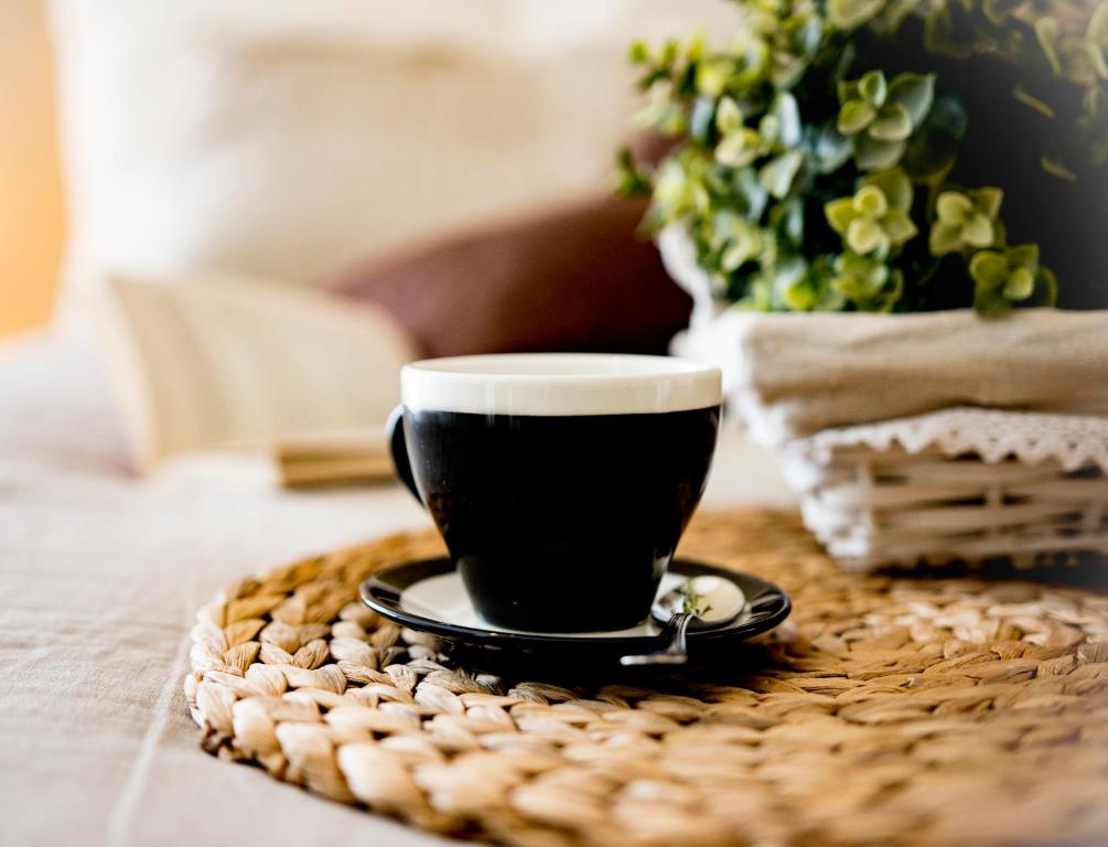a cup of coffee sitting on a table at Fabrì 171 in Pescara