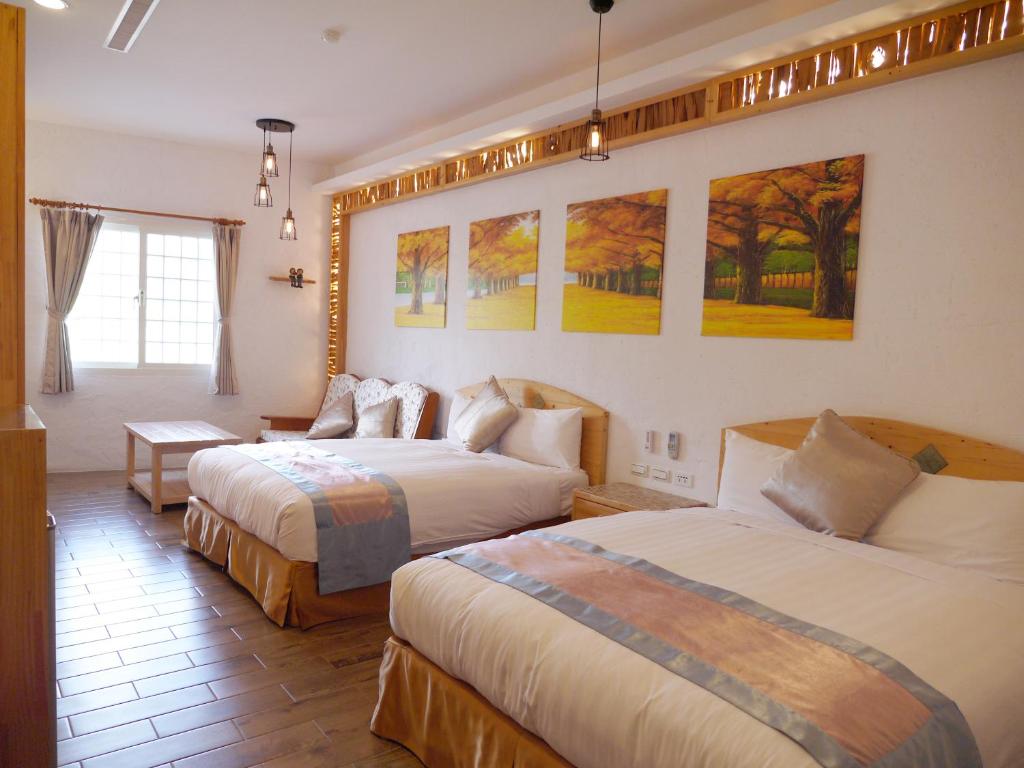 Postel nebo postele na pokoji v ubytování Kenting Sin Sin Hotel IIl