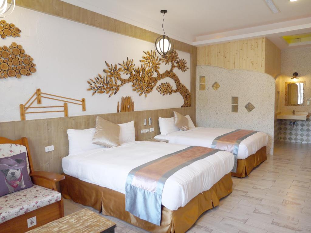Postel nebo postele na pokoji v ubytování Kenting Sin Sin Hotel IIl