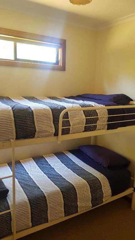 Postel nebo postele na pokoji v ubytování Parndana Hotel Cabins