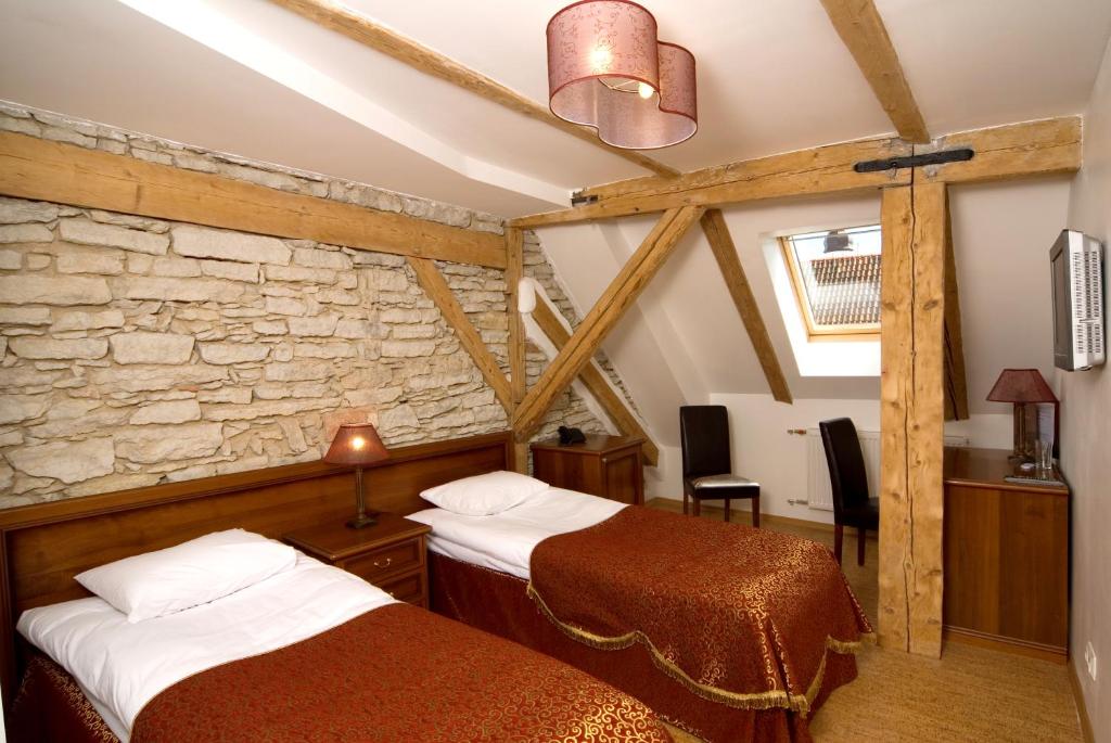 Postel nebo postele na pokoji v ubytování St.Olav Hotel