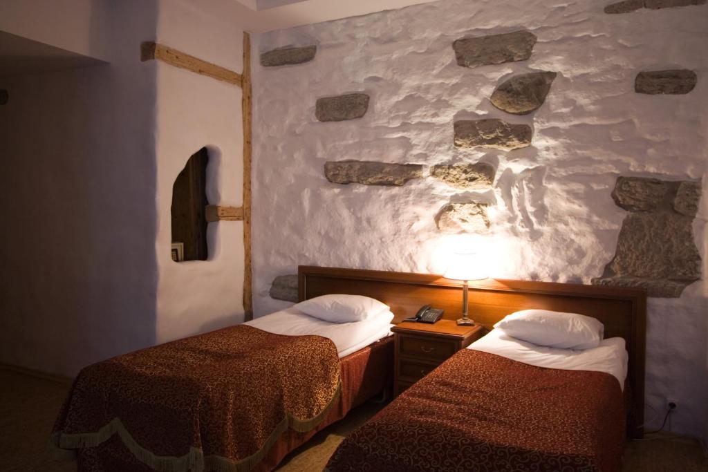 Postel nebo postele na pokoji v ubytování St.Olav Hotel