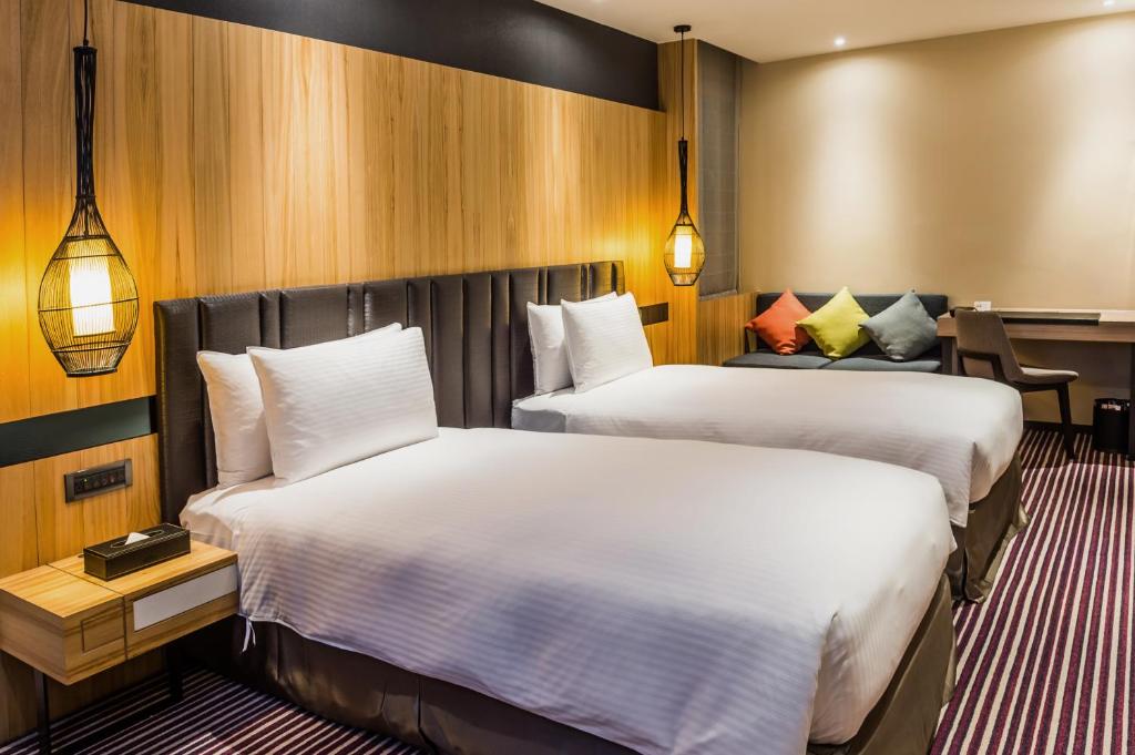Postel nebo postele na pokoji v ubytování La Vida Hotel