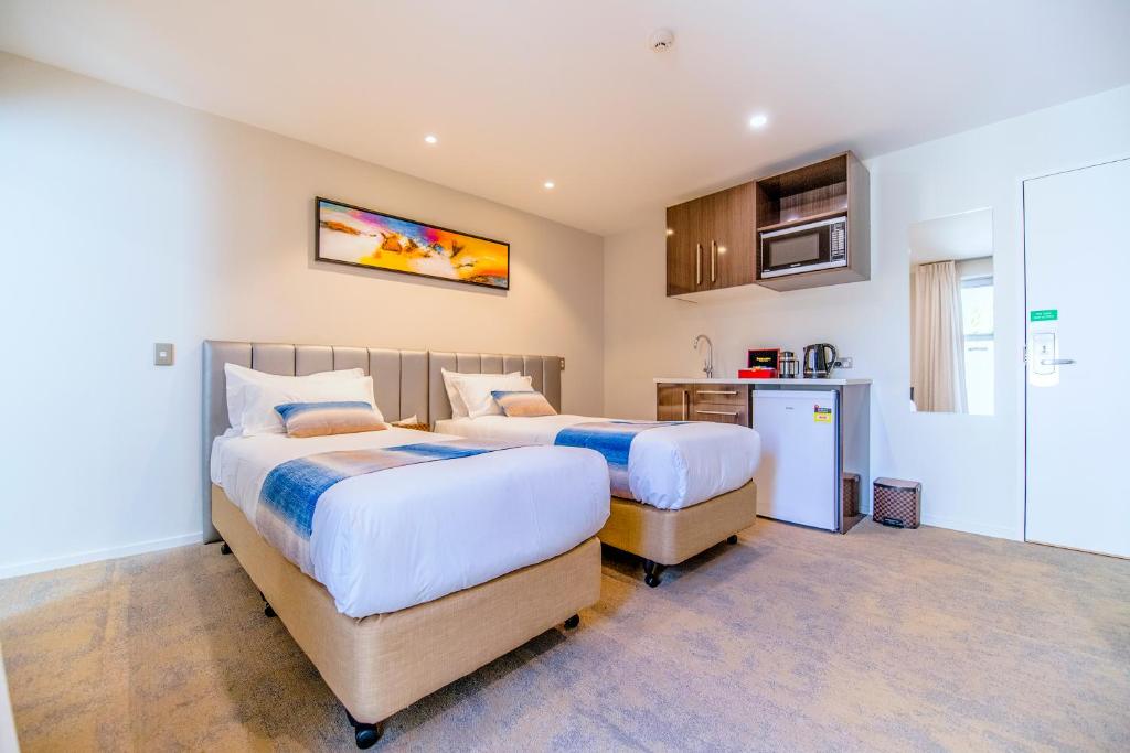 Postel nebo postele na pokoji v ubytování Alpine Hotel