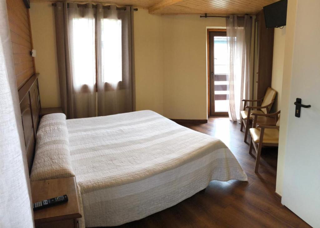 Postel nebo postele na pokoji v ubytování Hotel Sarao