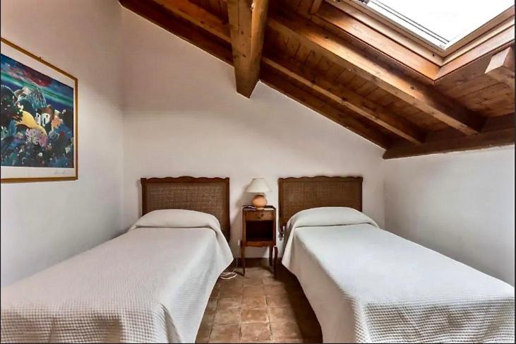 A bed or beds in a room at Borgo degli Aranci