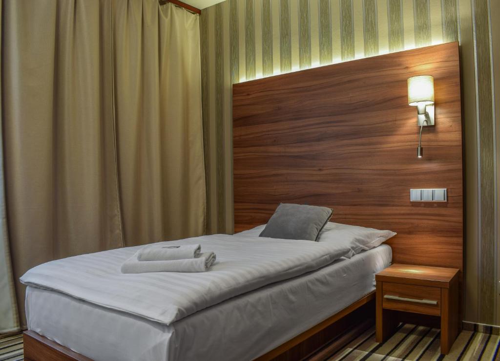 Postel nebo postele na pokoji v ubytování Hotel La Rosa