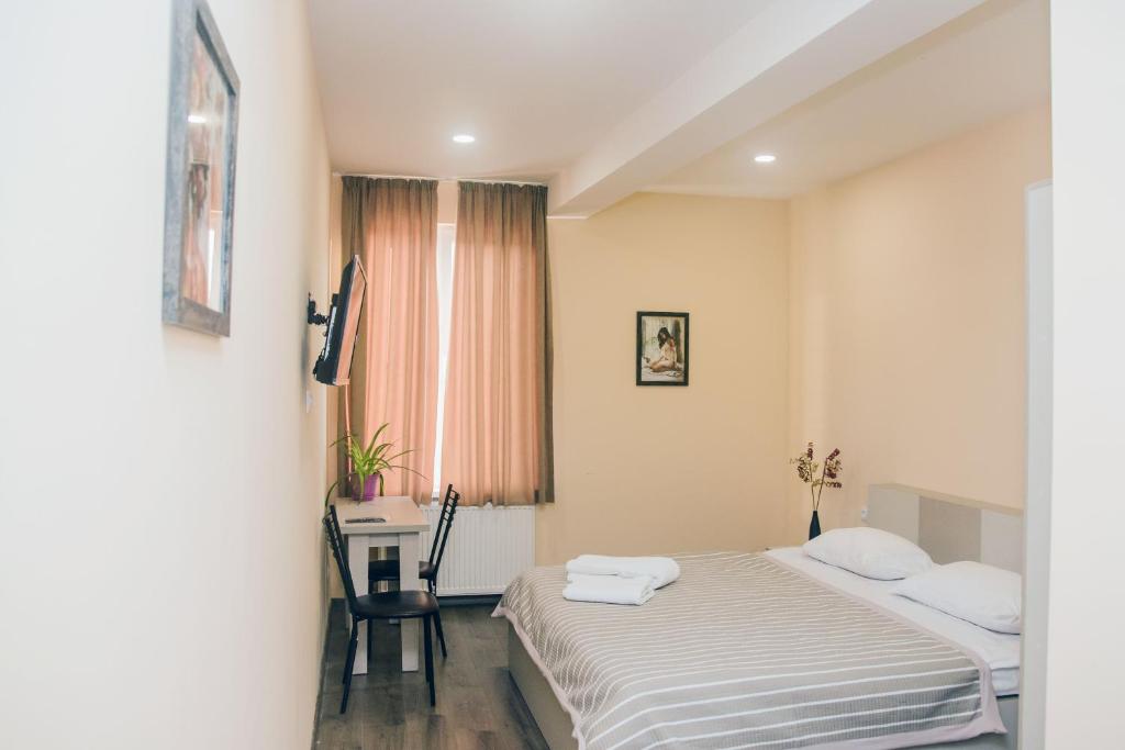 Postel nebo postele na pokoji v ubytování Red Hotel