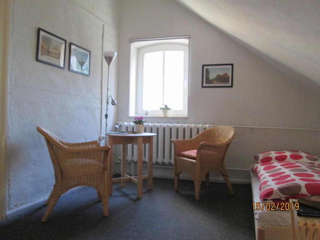 Posezení v ubytování Herberge im "alten Pfarrhaus" in Schmergow am Havel-Radweg