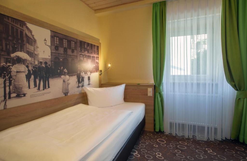 Postel nebo postele na pokoji v ubytování Hotel Wilder Mann