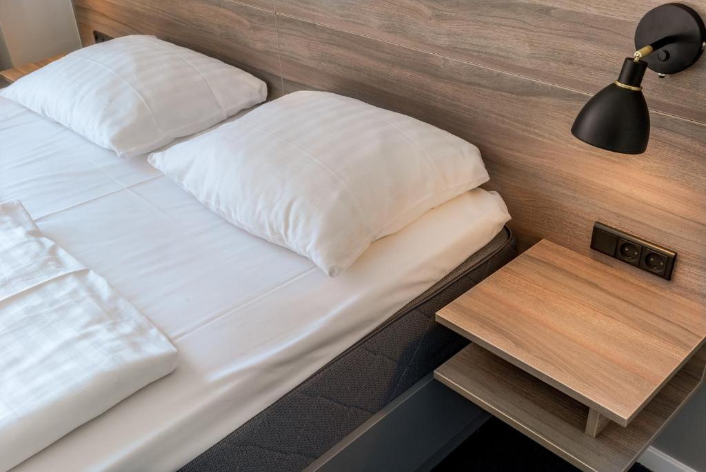 Postel nebo postele na pokoji v ubytování Copenhagen Go Hotel