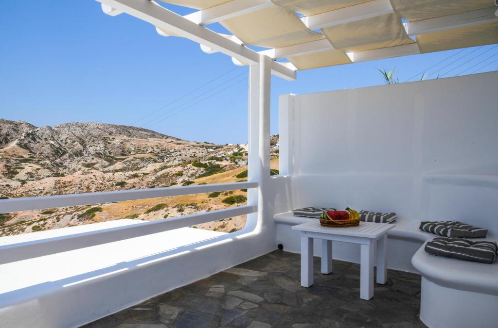 a white room with a view of a mountain at Agia Kyriaki Studios in Agia Kiriaki Beach