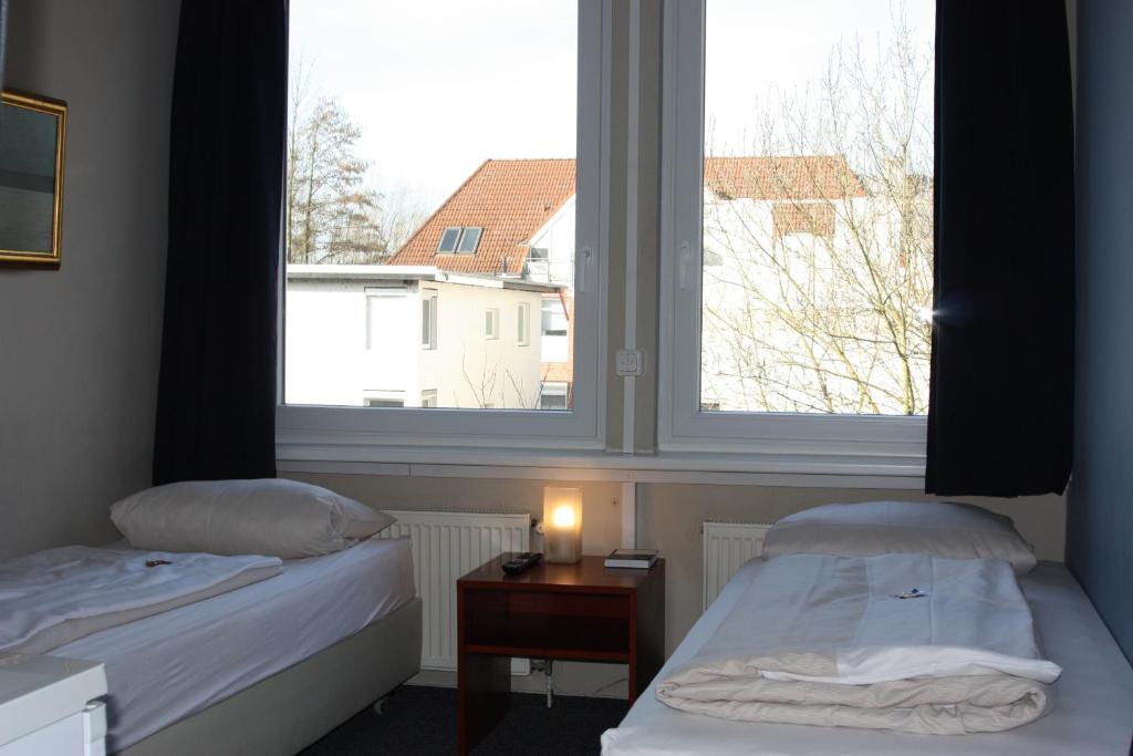 Krevet ili kreveti u jedinici u okviru objekta Ahoi-Gästehaus