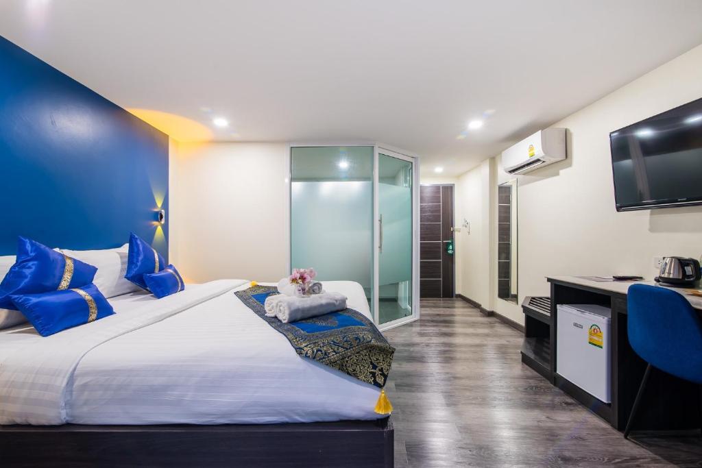 Uma cama ou camas num quarto em Anchan Hotel & Spa