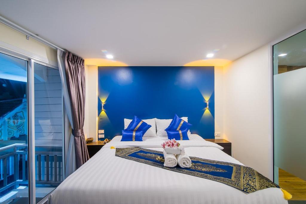 Uma cama ou camas num quarto em Anchan Hotel & Spa