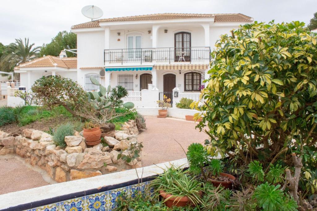 A garden outside Luxury La Zenia Beach Apartment