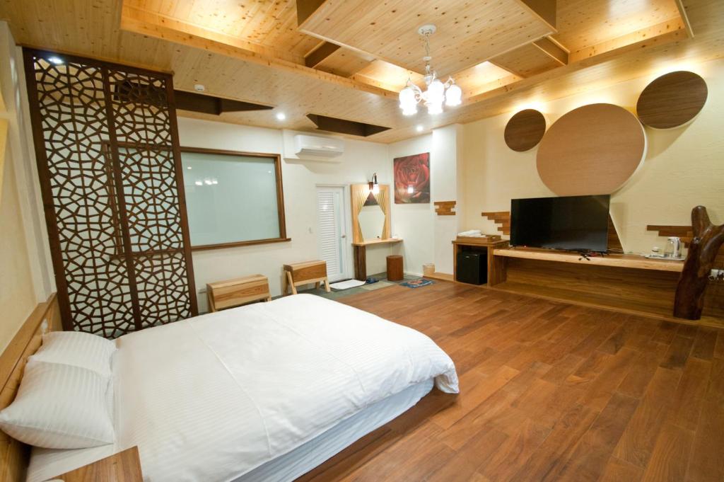 Postel nebo postele na pokoji v ubytování ChunYang Homestay春陽一品居
