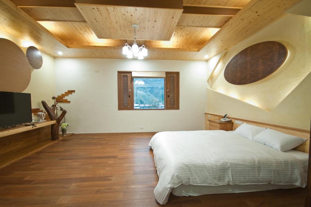 Postel nebo postele na pokoji v ubytování ChunYang Homestay春陽一品居