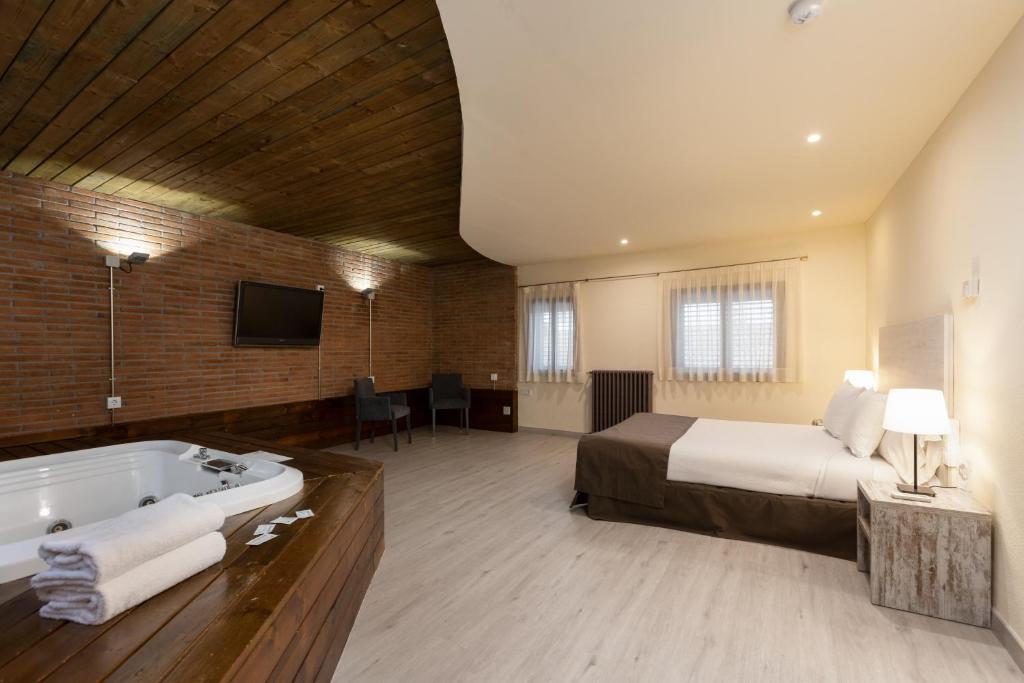 Postel nebo postele na pokoji v ubytování Apartamentos DV