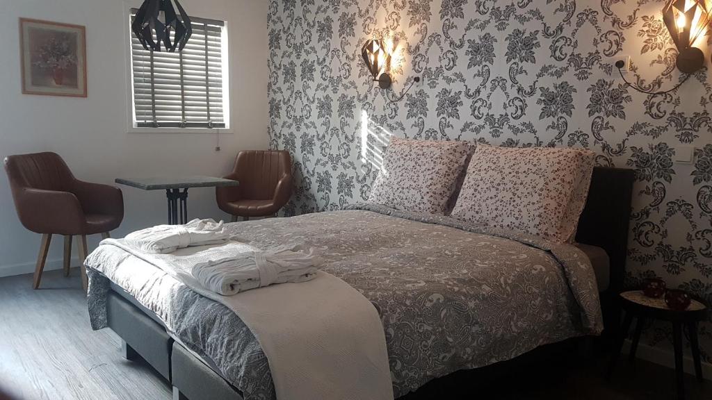 Postel nebo postele na pokoji v ubytování B&B de Valkenhorst