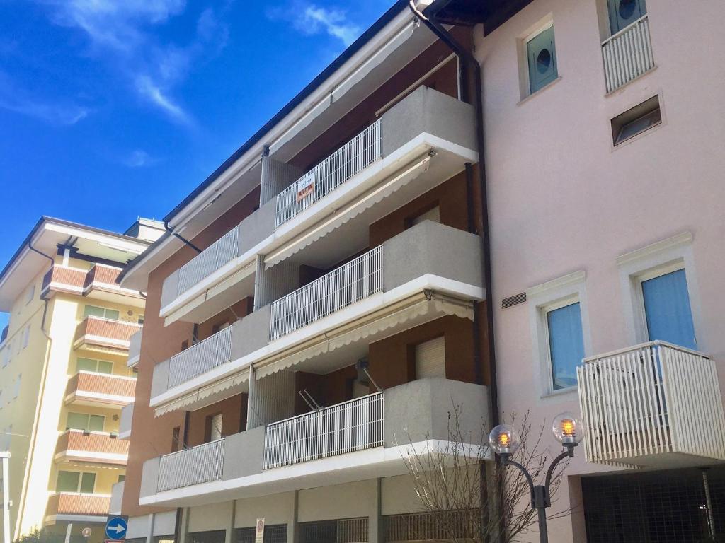 an apartment building with balconies on the side of it at Villa Nadia in Grado