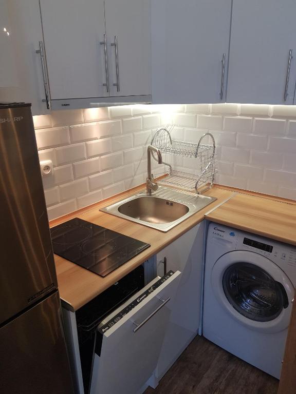 Kuchyň nebo kuchyňský kout v ubytování Cascade White Luxury Apartment