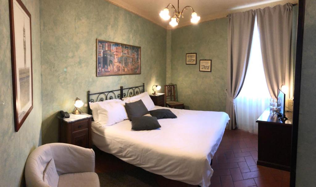 Кровать или кровати в номере Bellavista Impruneta