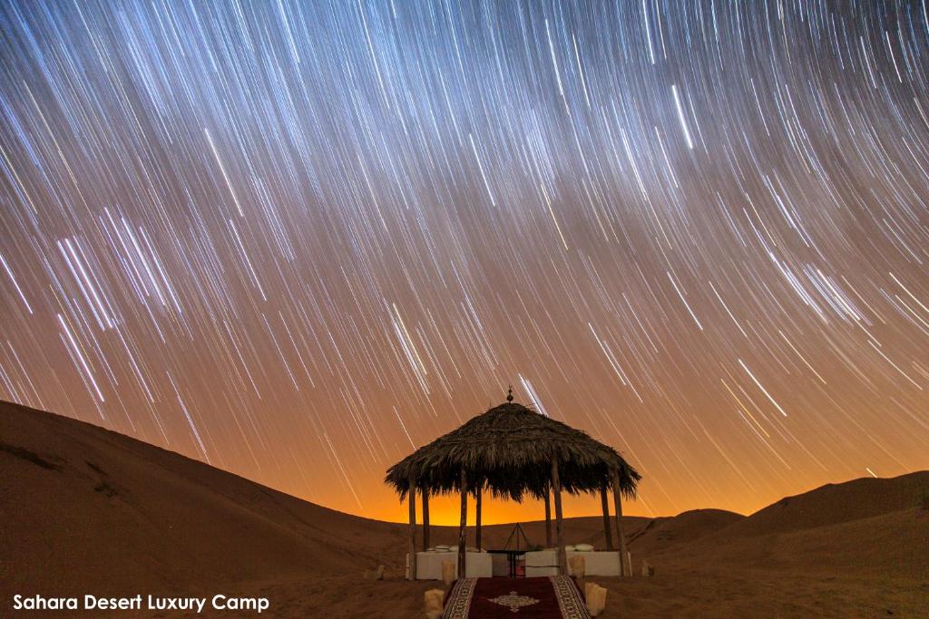 a view of the night sky with star trails at Sahara Desert Luxury Camp in Merzouga