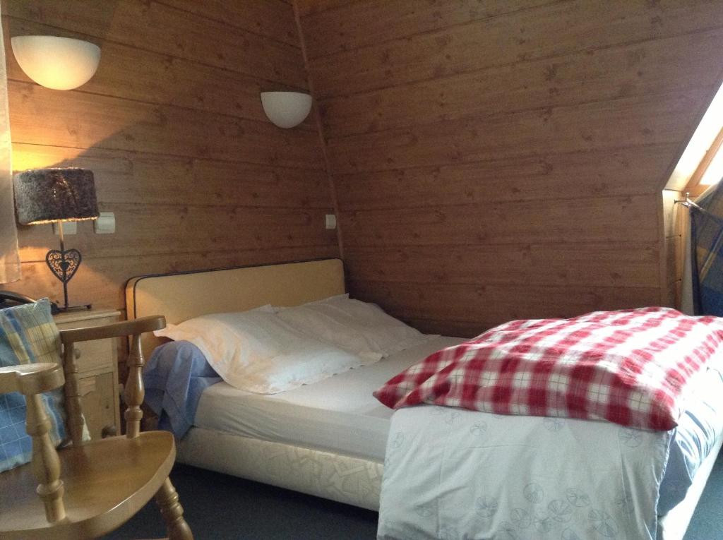 Postel nebo postele na pokoji v ubytování Hôtel Boule de Neige