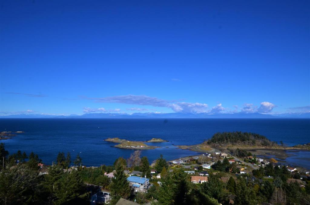 an island in the middle of a body of water at Gibralter Rock Ocean View B&B in Nanaimo