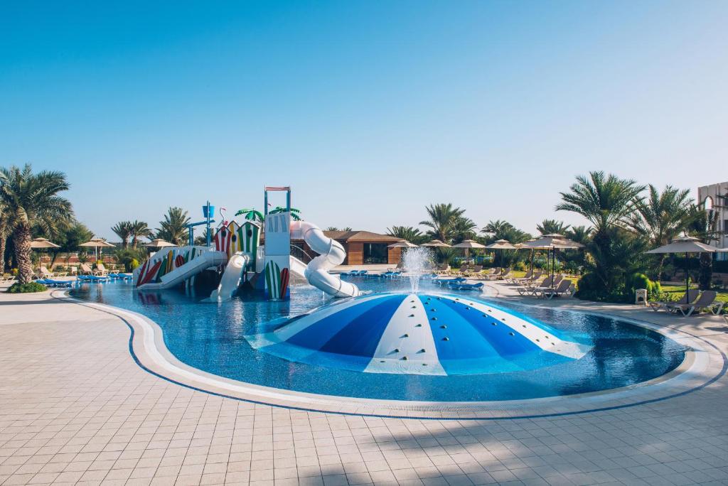 a water park with a water slide and slides at Iberostar Waves Mehari Djerba in Taguermess