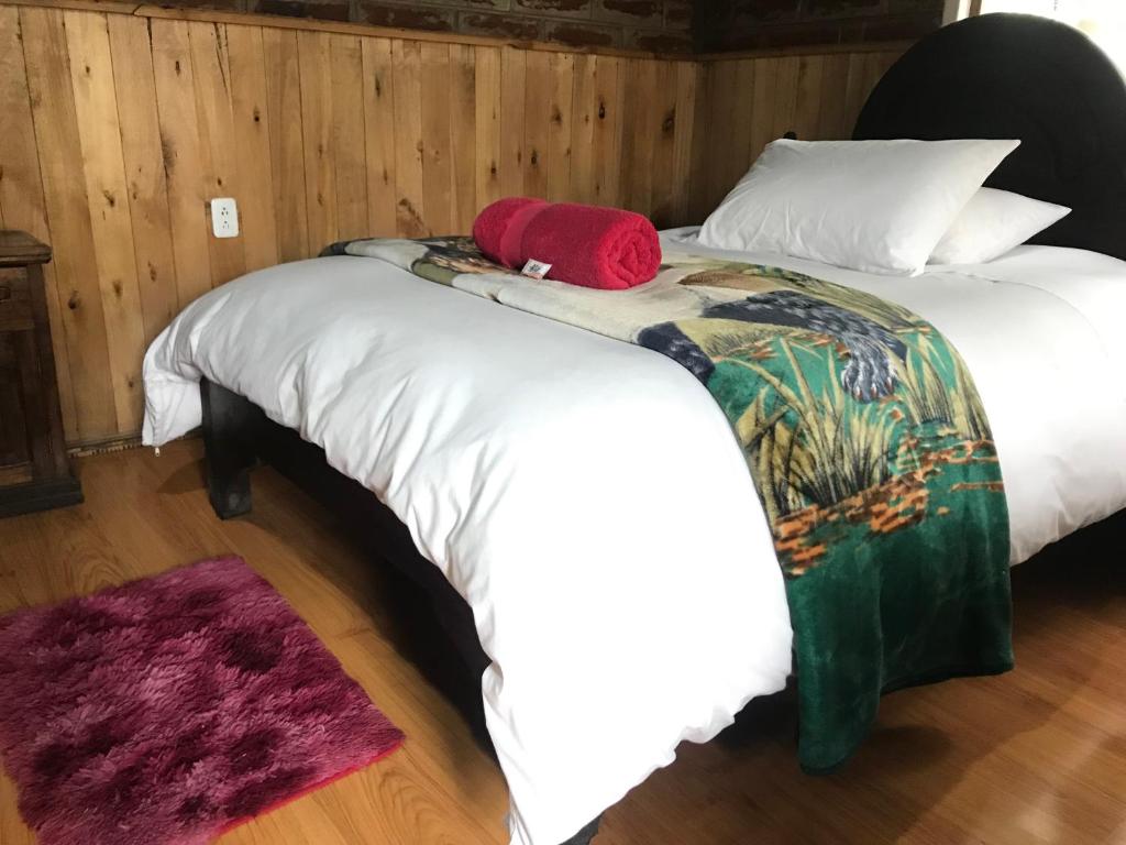 Postel nebo postele na pokoji v ubytování Hosteria Alpaka Quilotoa