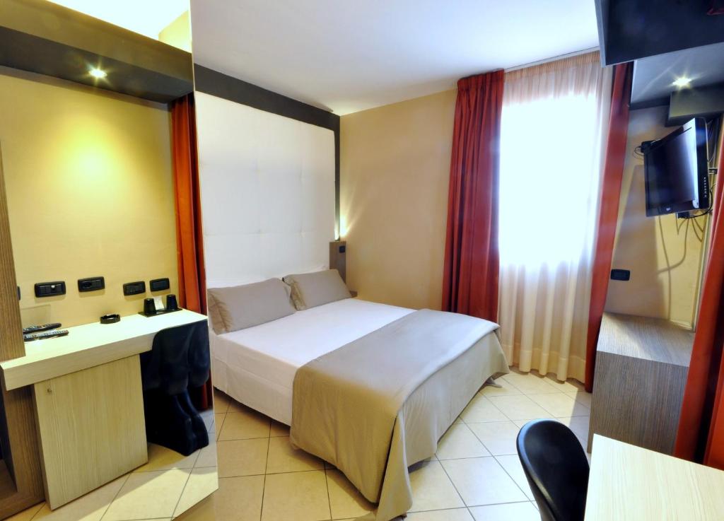 Postel nebo postele na pokoji v ubytování Planet Hotel