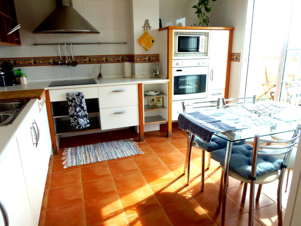 Kuchyň nebo kuchyňský kout v ubytování Apartamento Atico-Spa