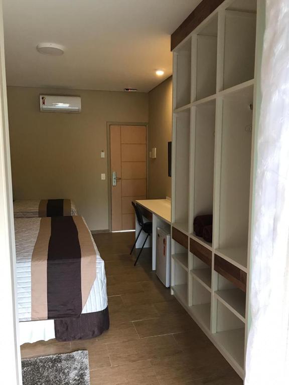 Cama ou camas em um quarto em Amoreiras Hotel Pousada