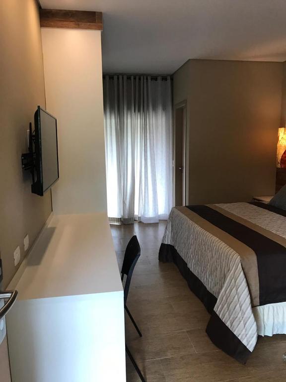 Cama ou camas em um quarto em Amoreiras Hotel Pousada