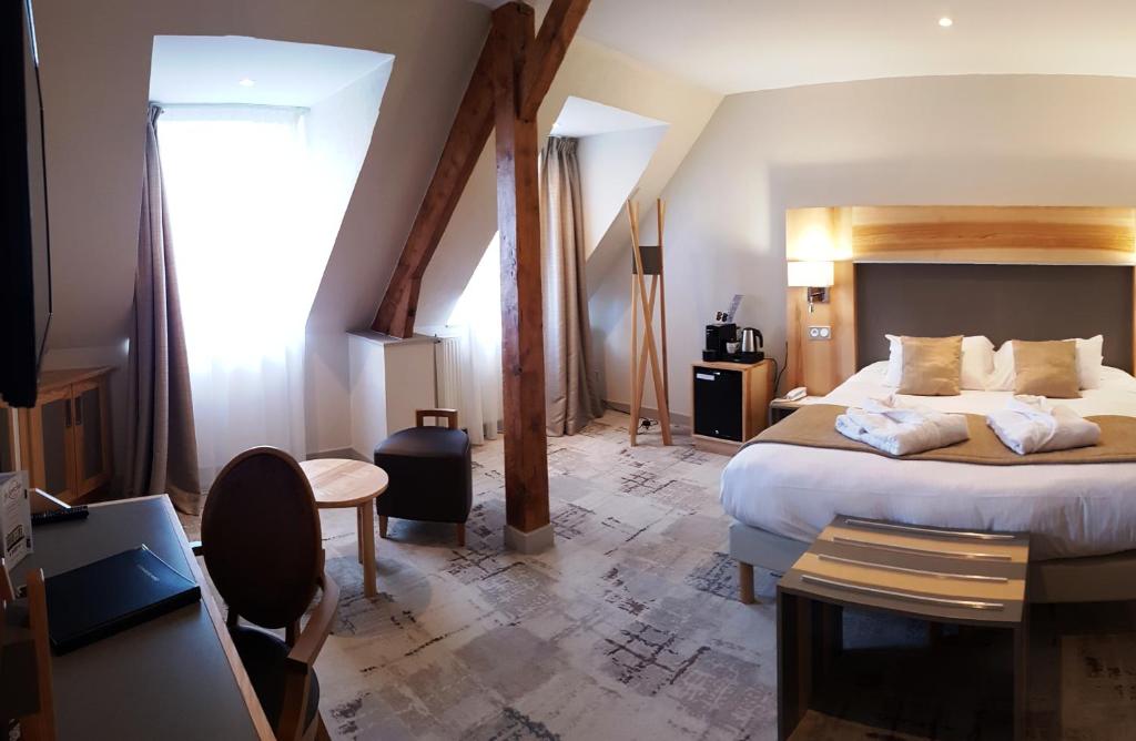 Postel nebo postele na pokoji v ubytování Hotel Le Cercle